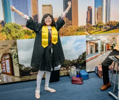 A happy JA student in a cap and gown.